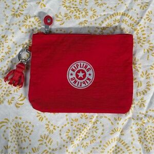 KIPLING for eva air red grey skyline graphic mini bag with monkey charm.